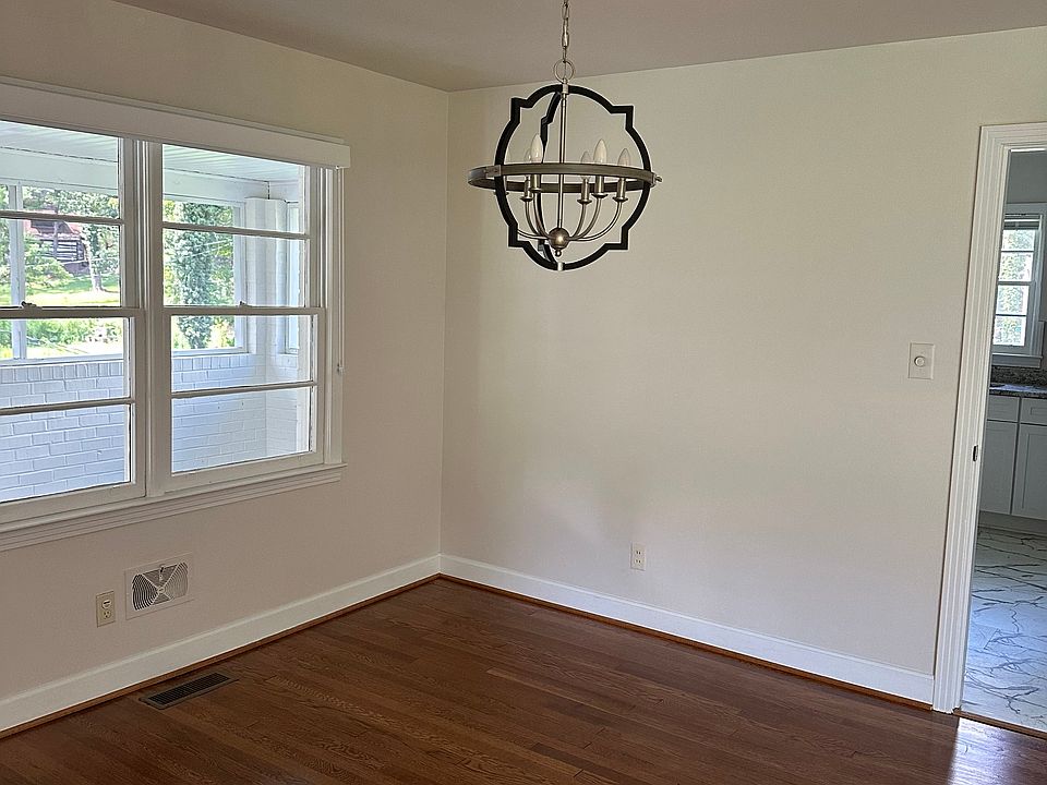 The dining area with a stunning nickel chandelier
