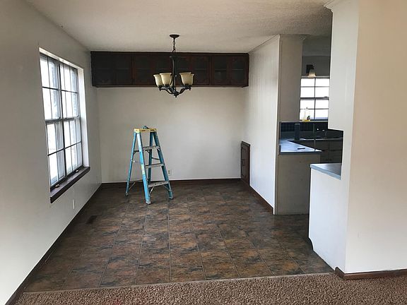 Dinning room from the living room with the kitchen door on the right