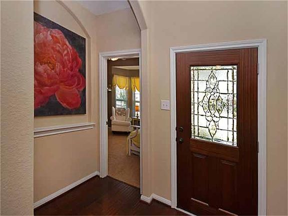 Arched doorways and niches add to the architectural interest throughout the home.