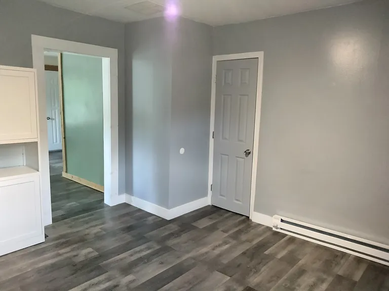 Kitchen showing bathroom door and entrance to living room