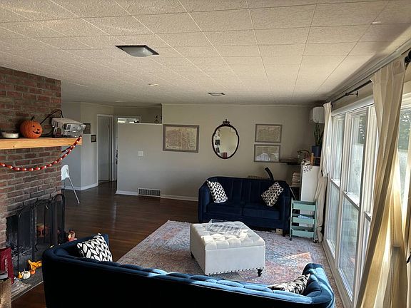 Living room with fireplace - large windows let in a lot of light into living room