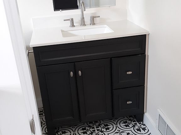 Bathroom with tile floors, heating and lots of light.