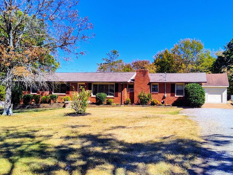 Freshly trimmed trees and new landscaping.