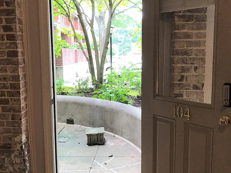 Looking at at private patio and second entrance to unit.