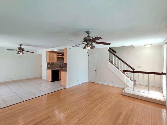 Entry Area Opening Into Living Room and Kitchen