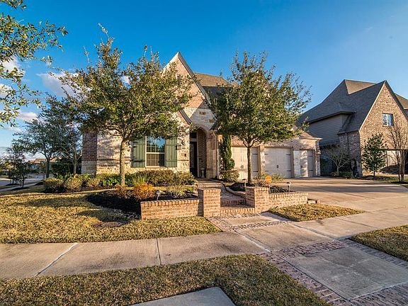 Here is a side view, notice the brick and stone facade, and you only have neighbors on one side and the back.