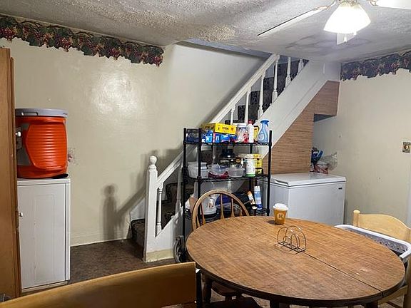 Back into Kitchen with Full Size Floor Freezer, and StairCase to 2nd Floor Rear BedRoom