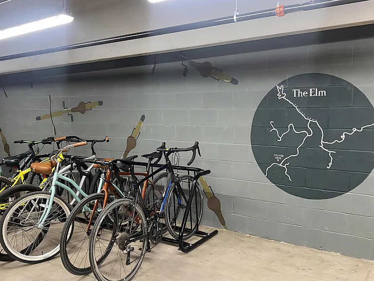 Secure Indoor Bike Storage with Controlled Access and Wall Mural