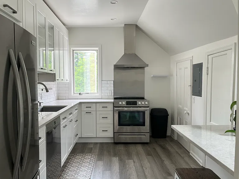 Newly remodeled kitchen. Two storage closets behind doors on the right