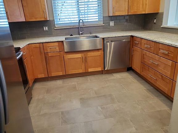 Beautiful kitchen cabinets and new floor.