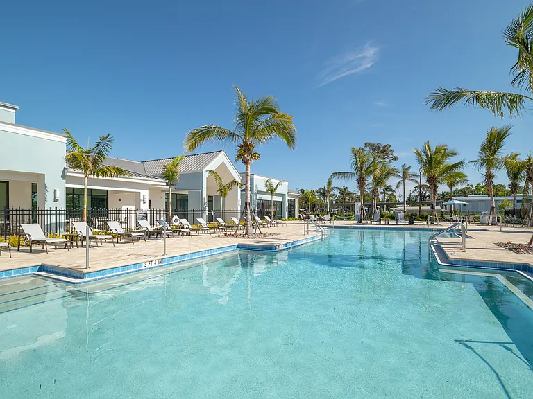 Imperial Crossing Luxury Apartment Homes resort style pool and lounge chairs.