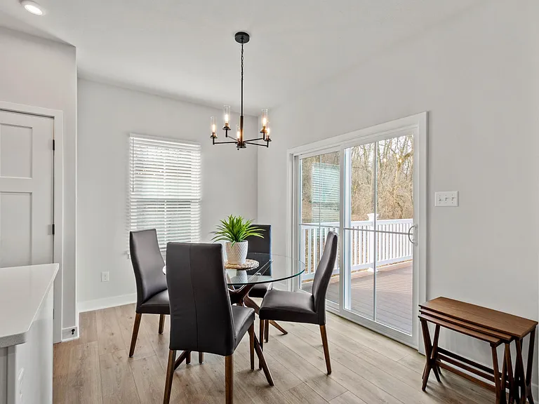 Enjoy wooded sunset views from the comfortable dining space