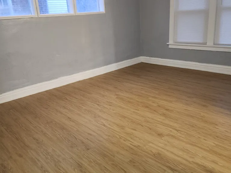This is the dining room. The flooring has recently been installed.