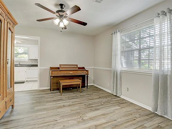 Immediately to the right of the front door, you will find newly installed waterproof wood laminate flooring in the dining room.
