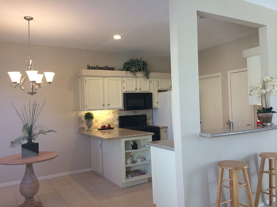 Gorgeous kitchen with eat in counter and bar top that overlo