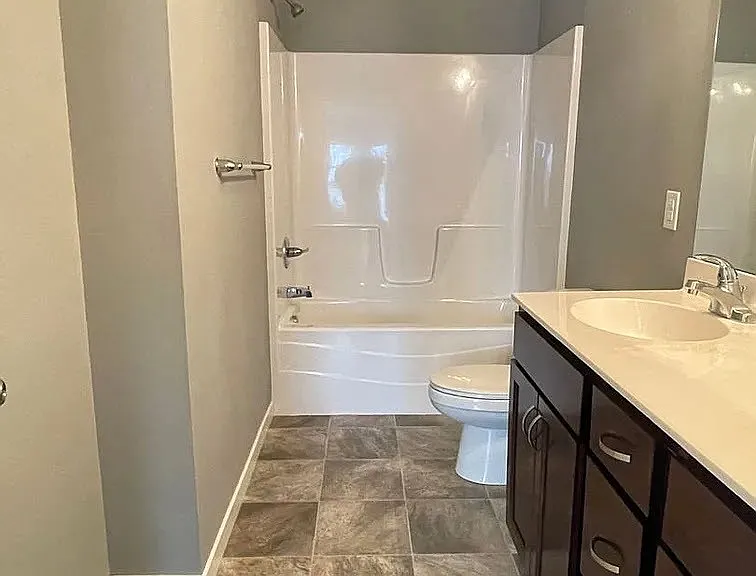 Elevate your daily routine in this modern bathroom, featuring elegant finishes and ample space. The sleek design ensures comfort and style flow seamlessly. Ready to upgrade your living experience? Explore LS Capital Group today!