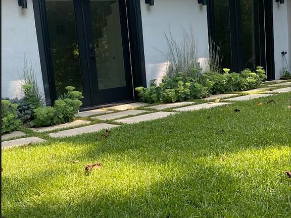 Private Entrance on Left Leading to Studio. French Doors to the R lead to (Optional) Gym. French Doors are outfitted with Screens and Custom Top Down/Bottom Up Window Shades. Exterior Lights Illuminate the Entrance.