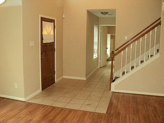 Beautiful entry with wood and tile through out bottom level