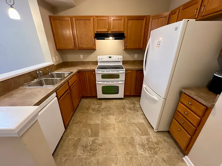 Kitchen with Double Oven, Dishwasher, and Garbage Disposal