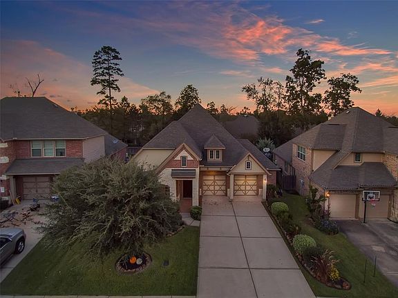 Situated on lot with mature trees nearby.