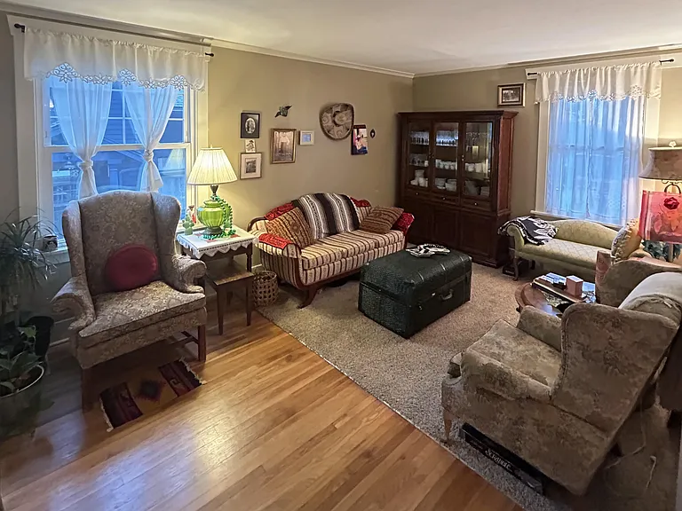 The Family Room | Secondary living room with additional lounging space, and decor celebrating family roots.