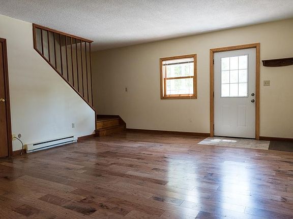 entry, living area, stairs to second floor.