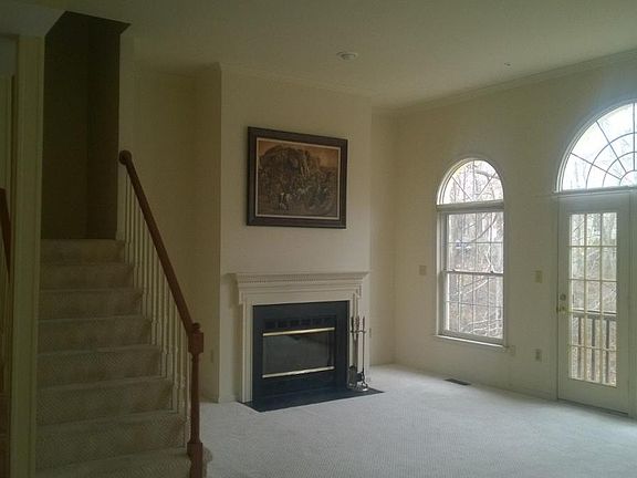 Great Room with wood-burning Fireplace and high ceiling