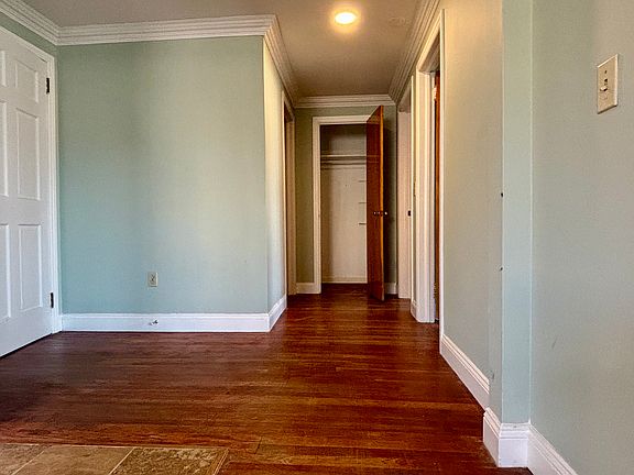 Hallway to bedrooms, with storage closet