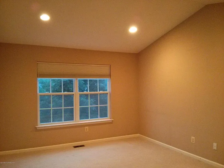 Big master bedroom with bright double windows