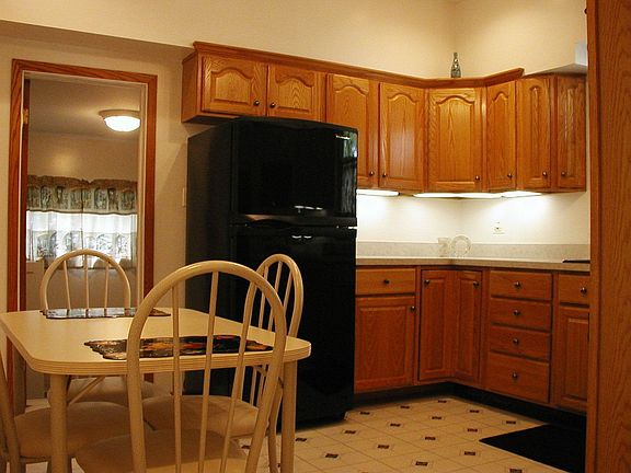 Kitchen next to mechanical room and laundry