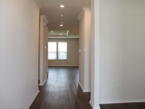 Durable luxury vinyl plank flooring makes it easy to keep the downstairs living space clean