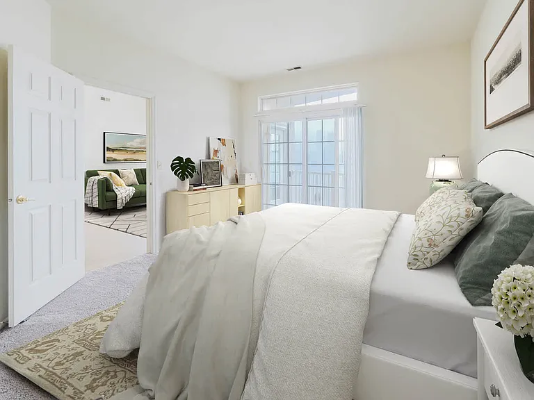 Carpeted Living Room with Balcony