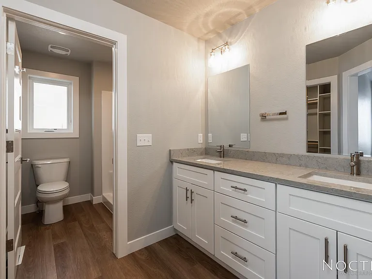 Master bedroom with ensuite bath and grand closet. (Photo of another unit with similar finishes and quality.)