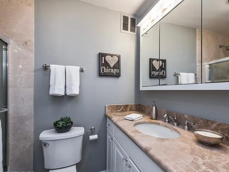Bathroom with marble counters