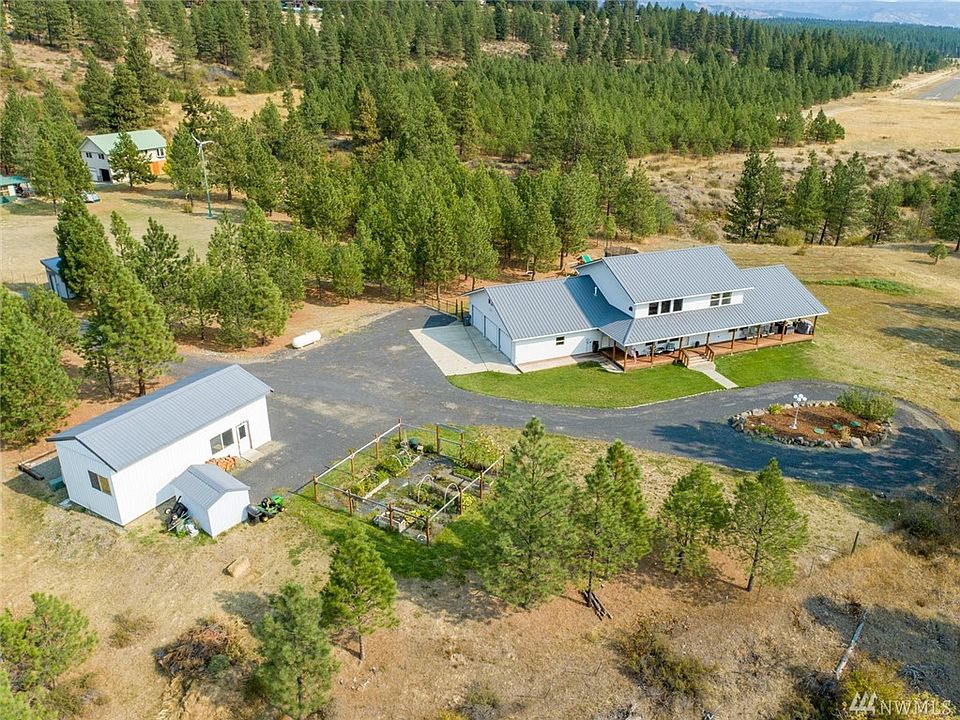 Come enjoy rural living just minutes from town! Updated farmhouse style home, with 3 car attached garage, big shop, all on 3 manageable parked out acres- WITH Southern Exposure and views of Peoh Point!