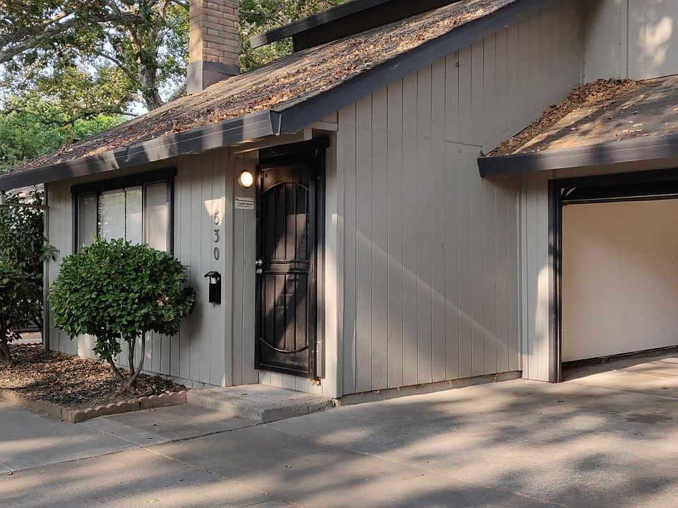 Exterior image of front door and garage