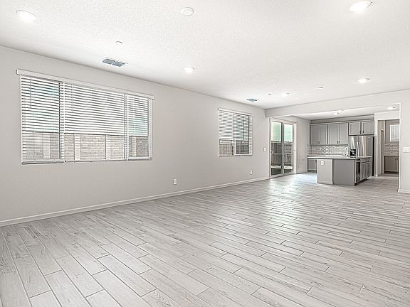 Open-concept great room, dining room and kitchen space.