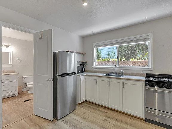 Kitchen and entrance to private bath.