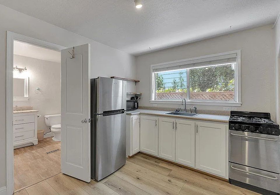 Kitchen and entrance to private bath.