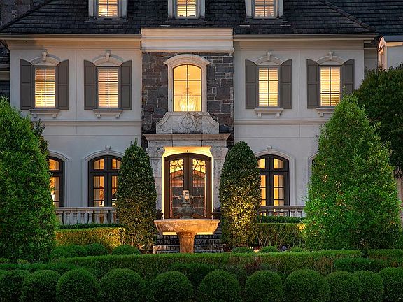 Stone stucco exterior and double Cantera front door.