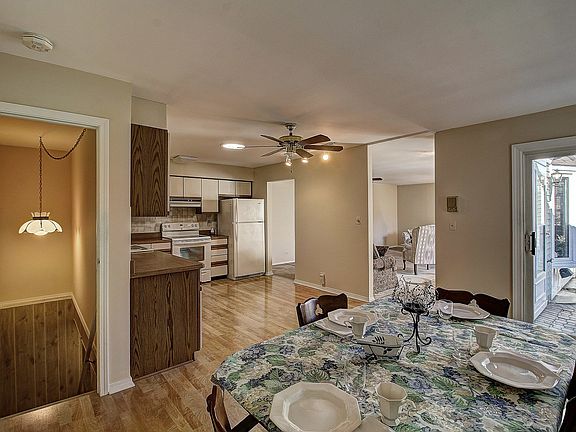 KITCHEN VIEW FROM THE FAMILY ROOM. NOW IT HAS THE DINING TABLE IN IT. ALSO A SOLAR TUBE FOR NATURAL LIGHT