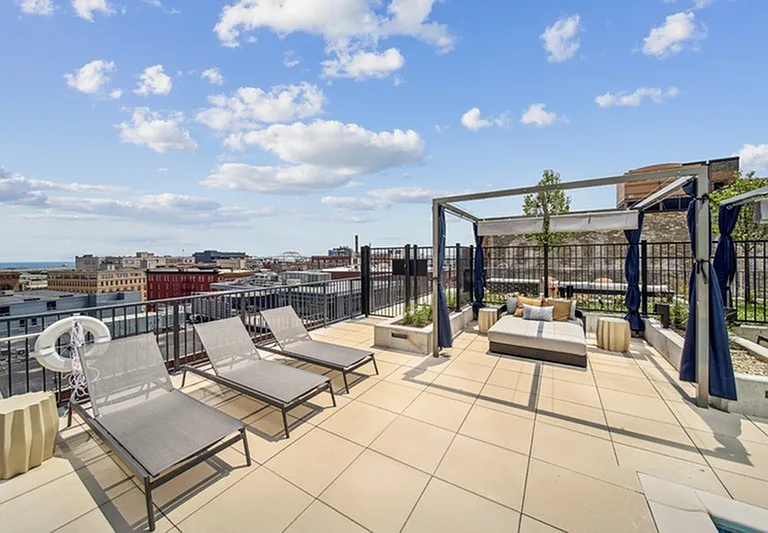 Elevate the evening _ a rooftop retreat where firelight, skyline views, and laid-back luxury come together.
