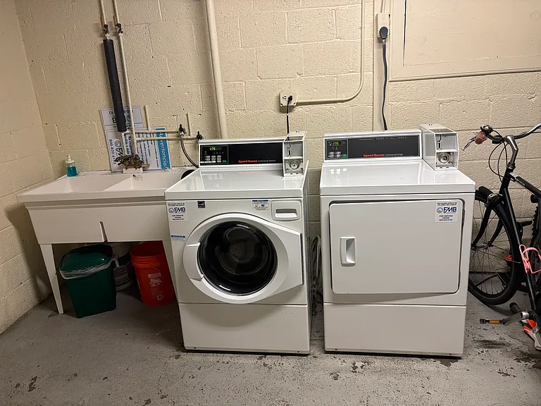 Large washer/dryer and bike rack storage in basement for resident use.