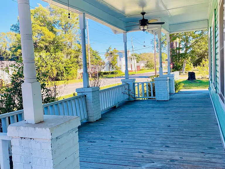Front porch with steps off the front and side