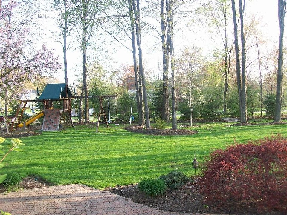 Stone patio w/lush yard