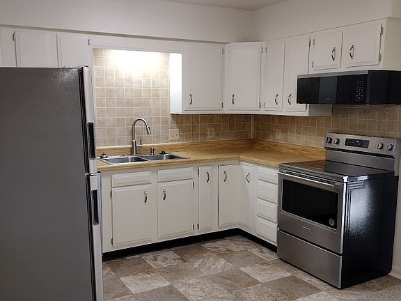 The appliances are white, not stainless still. Otherwise as shown.