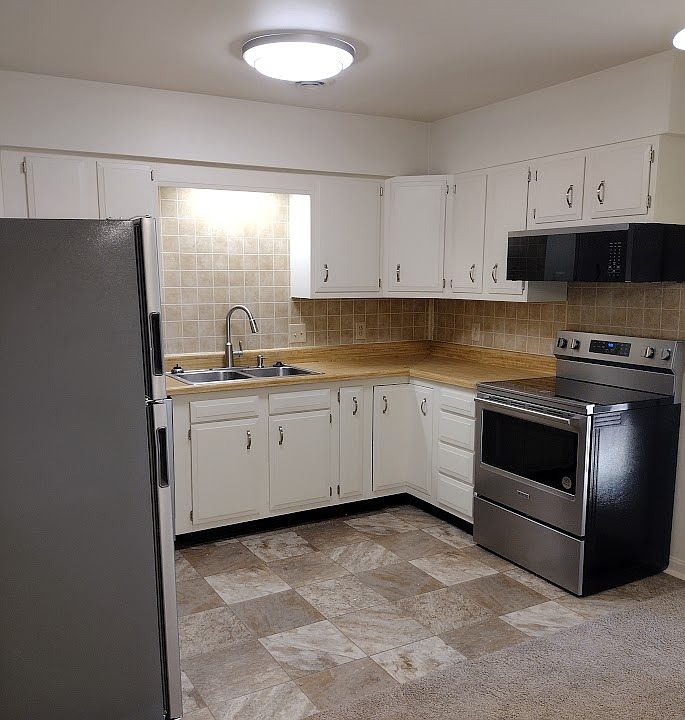 The appliances are white, not stainless still. Otherwise as shown.