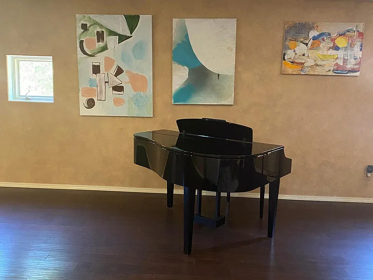 Living room. You can play piano anytime