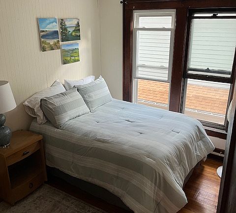 Bedroom pictured with a full sized bed. The other bedroom, has a queen sized bed.