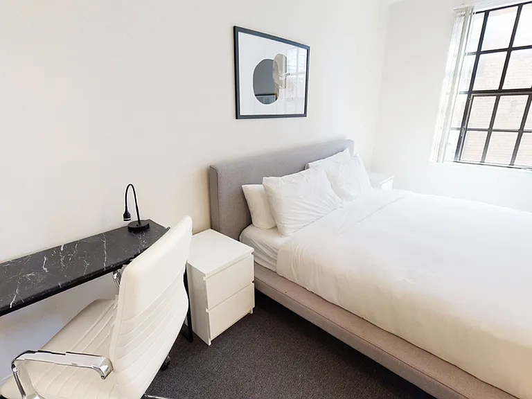 Bedroom at Bachenheimer Apartments. Some homes include built-in desks!